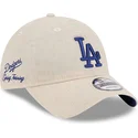 bone-curvo-bege-ajustavel-com-logo-azul-9twenty-linen-spring-training-fan-pack-2025-da-los-angeles-dodgers-mlb-da-new-era